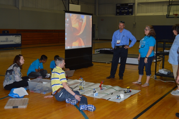 Teachers learn about robotics and how to teach it, from other teachers.