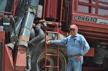 LaSalle farmer Lloyd Kulak stands by his cotton picker.