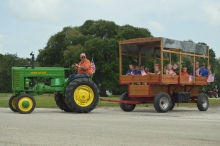 Children enjoyed a ride in a covered trailer pulled by a tractor on July 4 at Brackenridge Park.